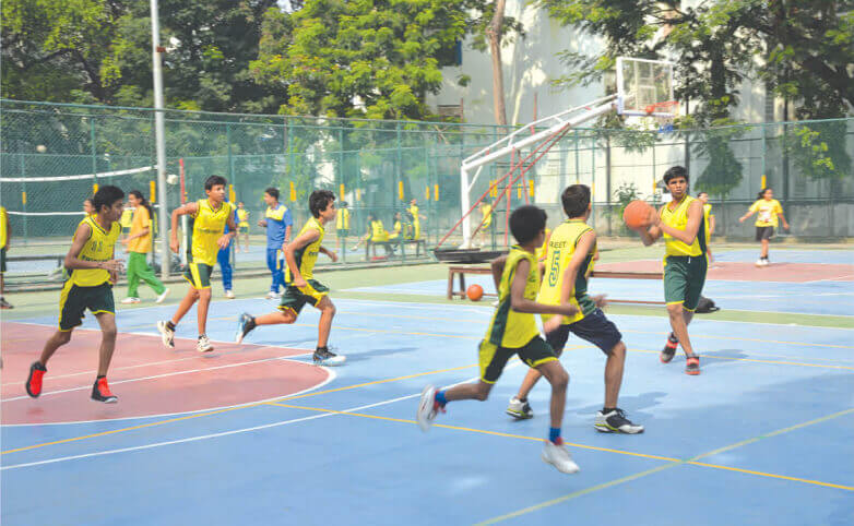 Students playing basketball